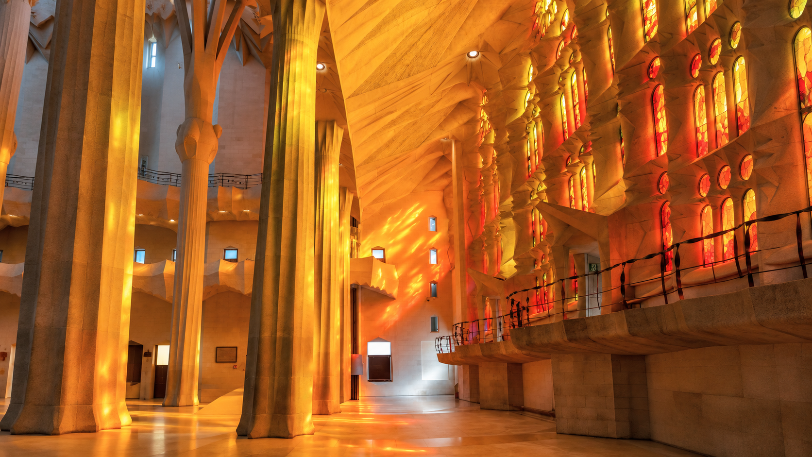Sagrada Família Interior Architecture Warm interior view of Sagrada Família columns and stained-glass windows in Barcelona